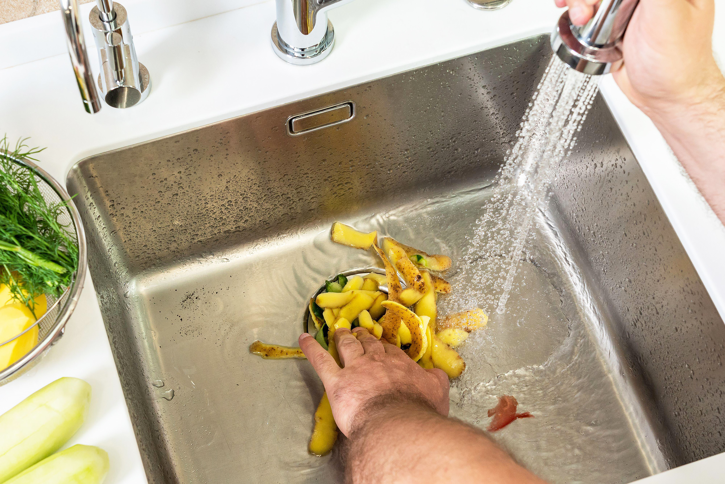 Plumber Removing Garbage Disposal Plumber Removing Garbage Disposal